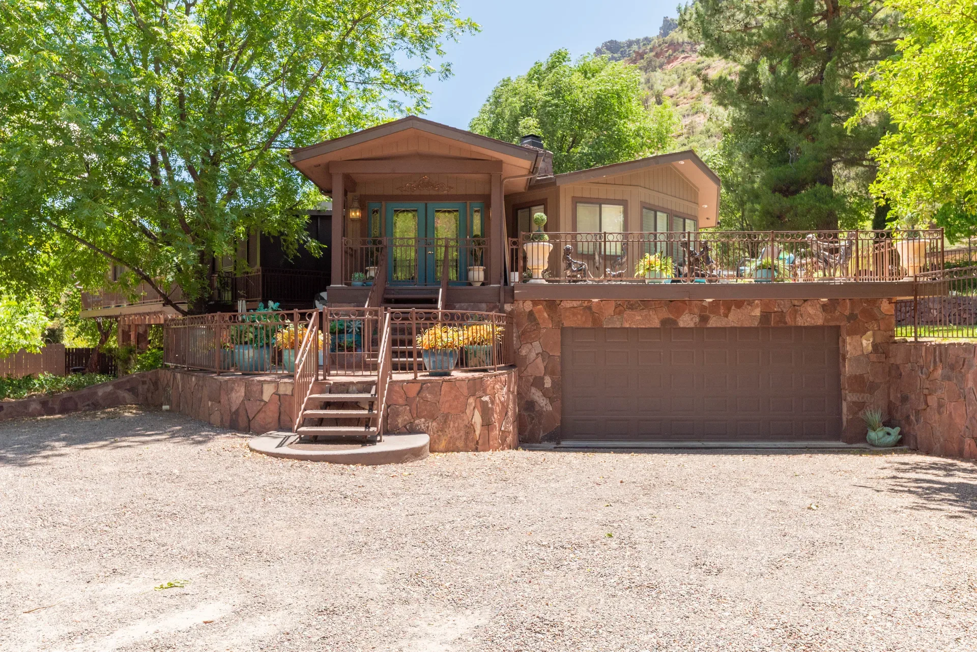 Resort unit with raised wooden deck and metal railing
