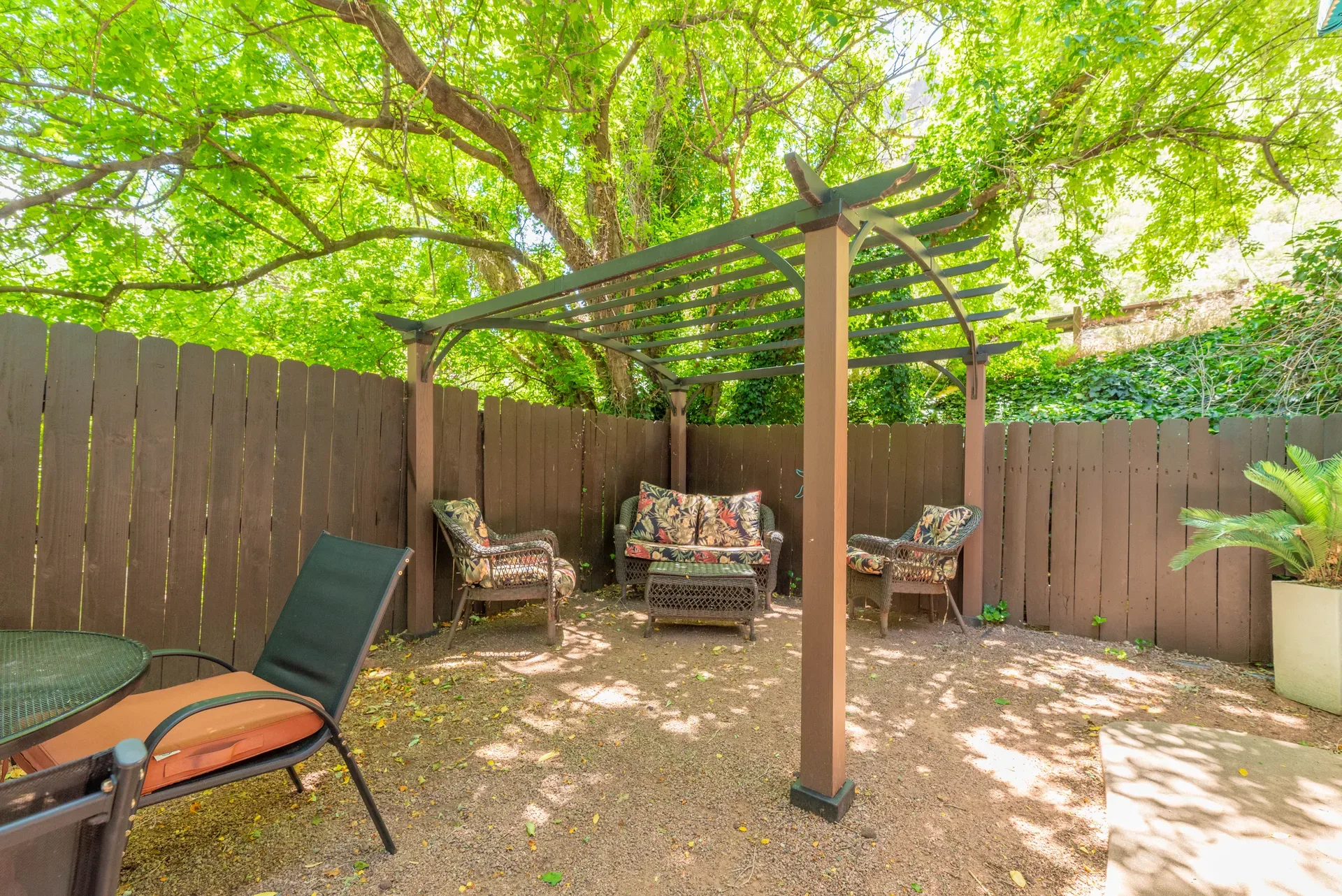 Wood-framed pergola with outdoor seating area