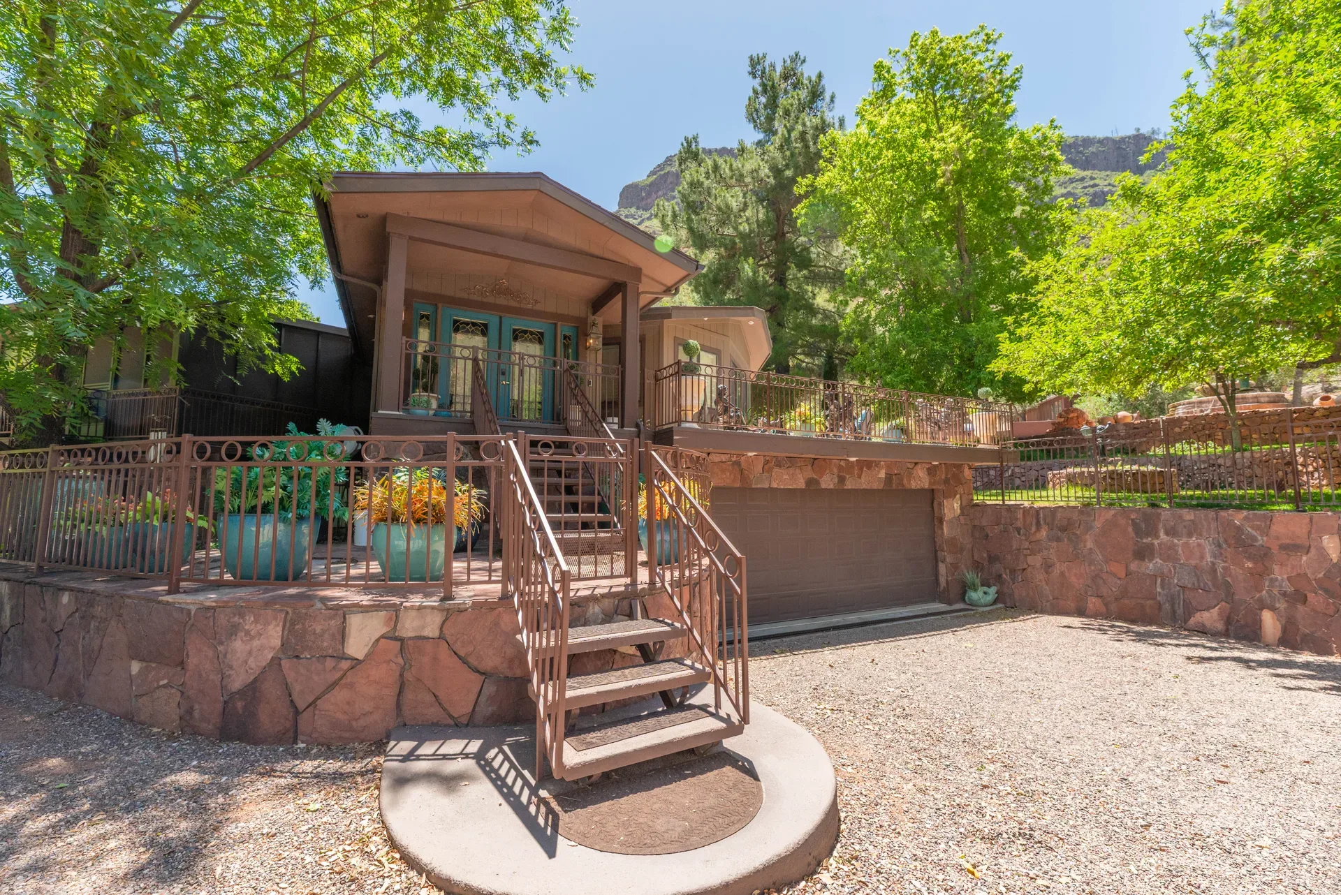 Bungalow with red rock formations visible in background