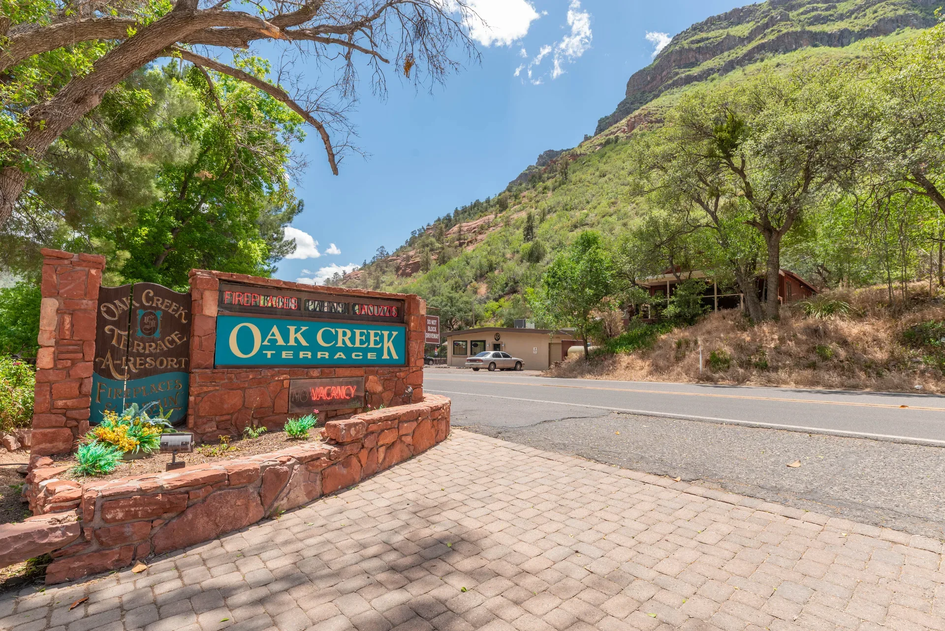 Oak Creek Terrace Resort entrance sign with red rock canyon backdrop