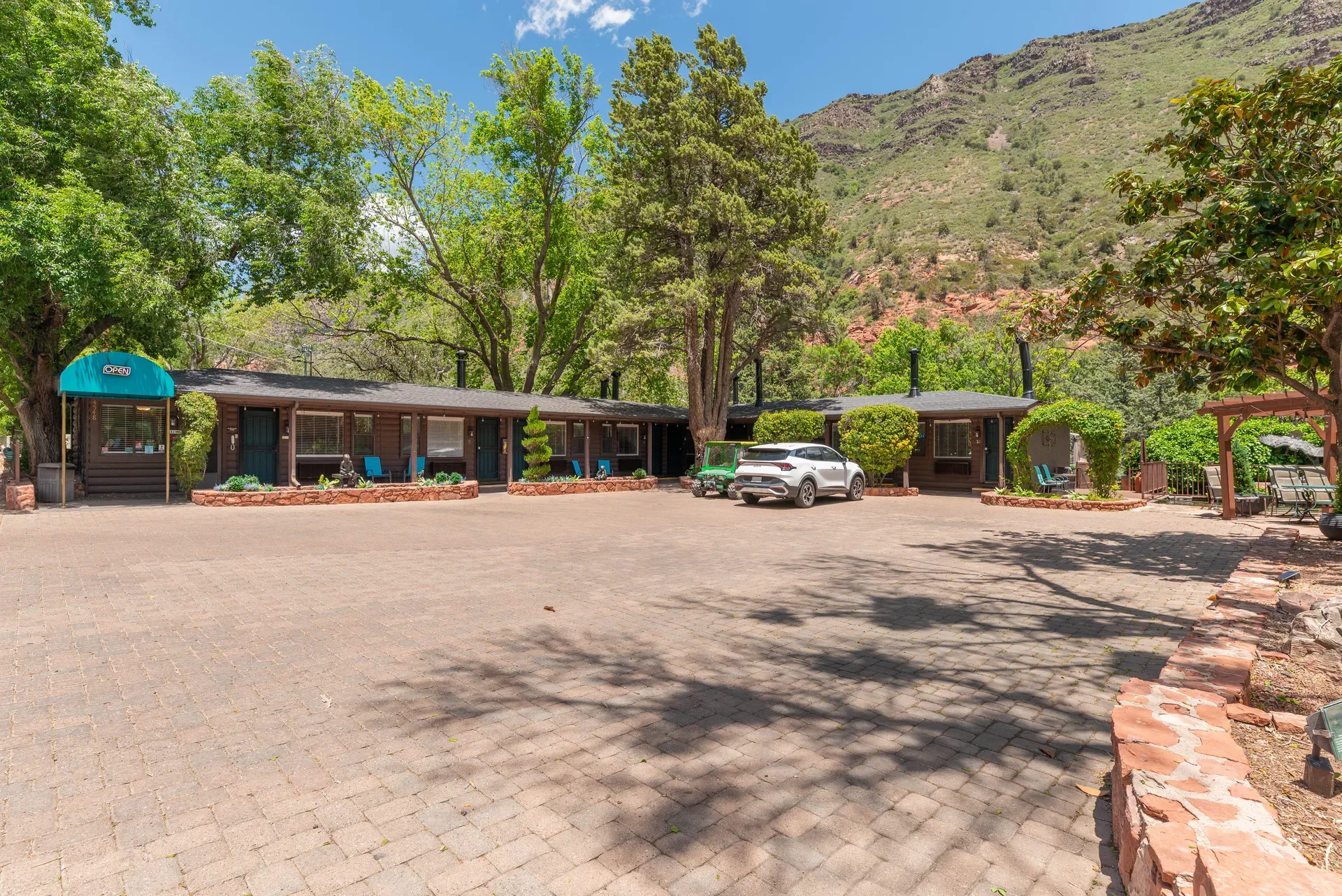 Resort arrival courtyard with paved parking area