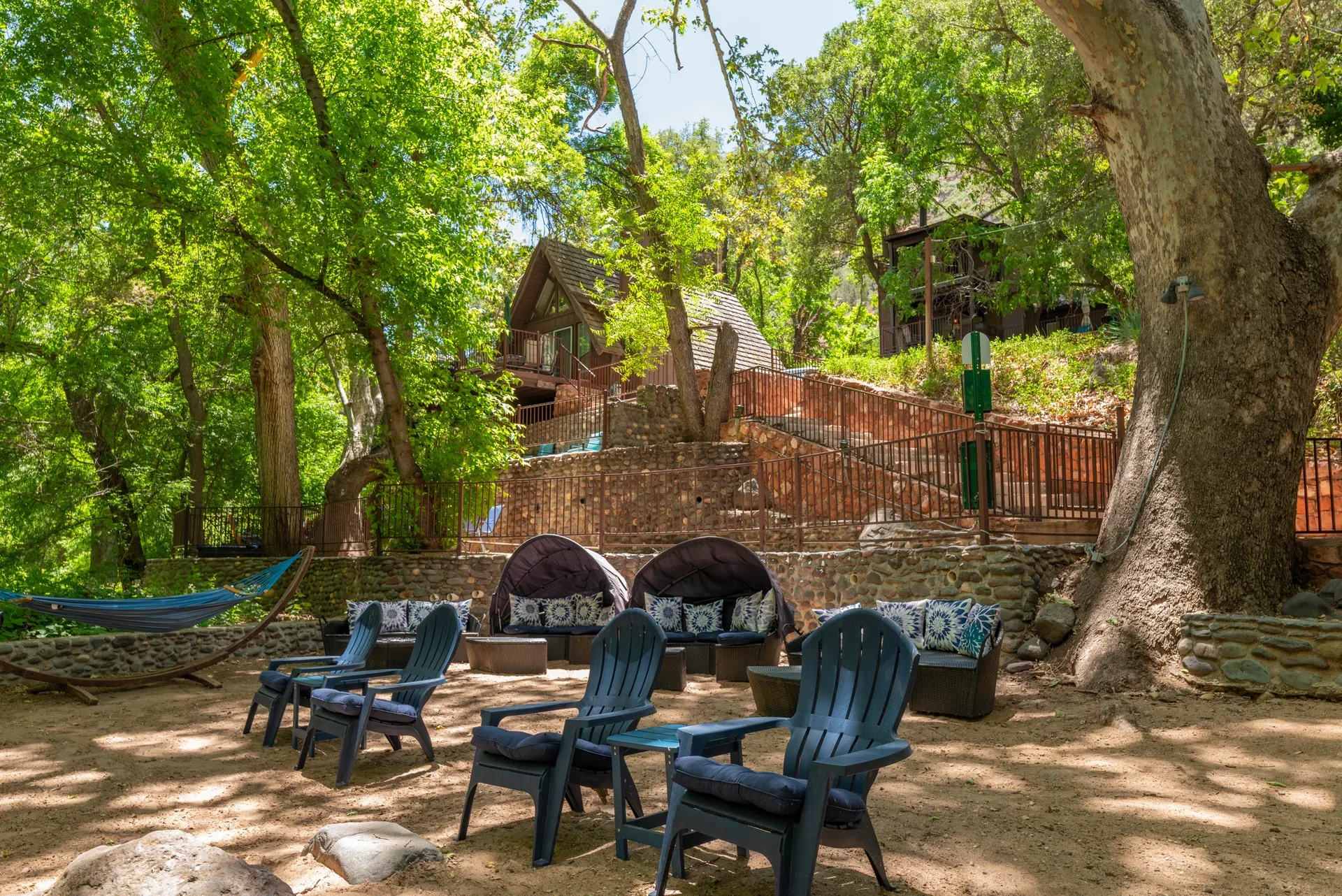 Courtyard with Adirondack chairs, daybeds, and hammock
