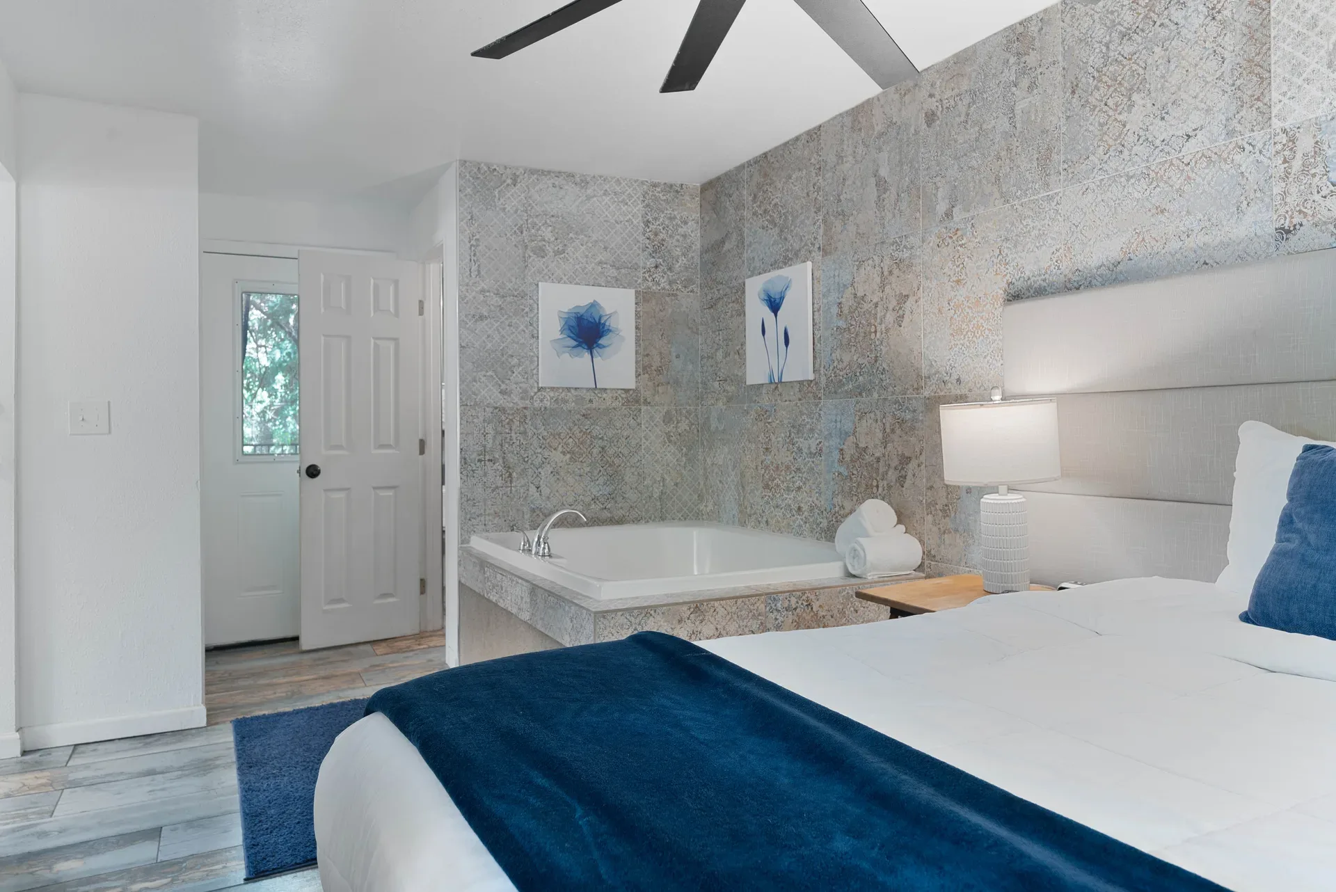 Master suite bedroom with integrated jetted tub