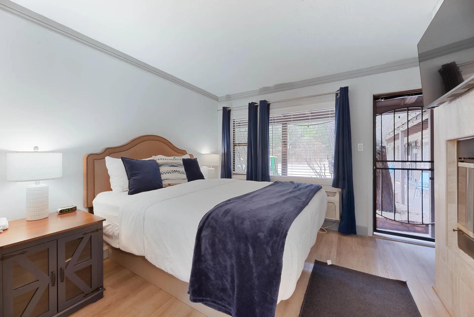Guest room with patio door and mountain views