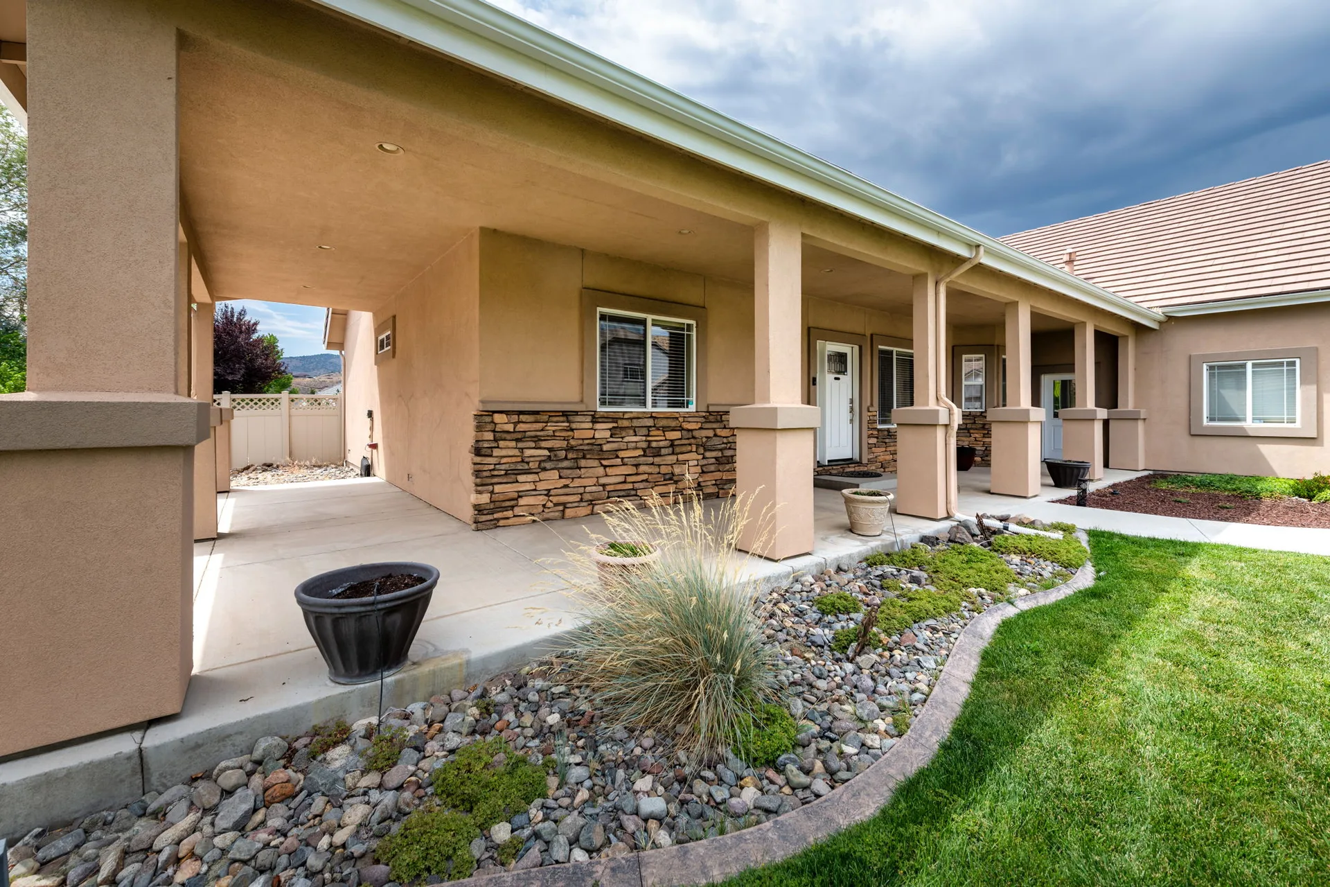 Covered front porch entry with stone accents