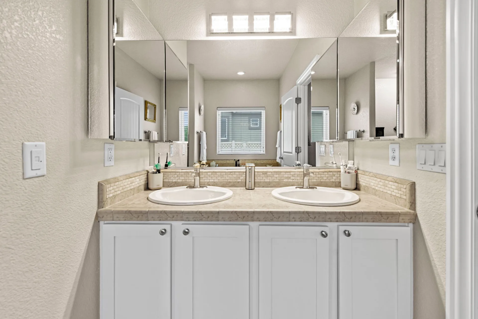 Bathroom double vanity with white cabinetry