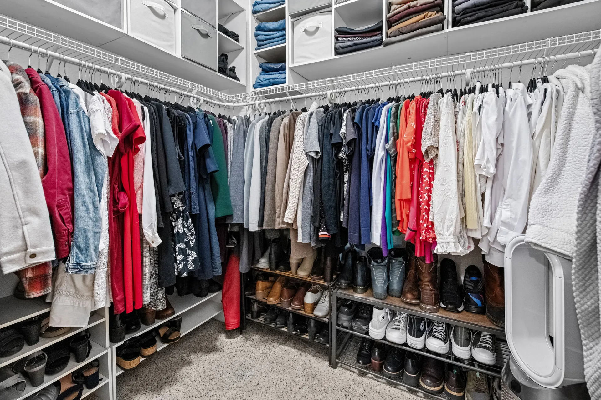 Walk-in closet with wire shelving and storage cubbies