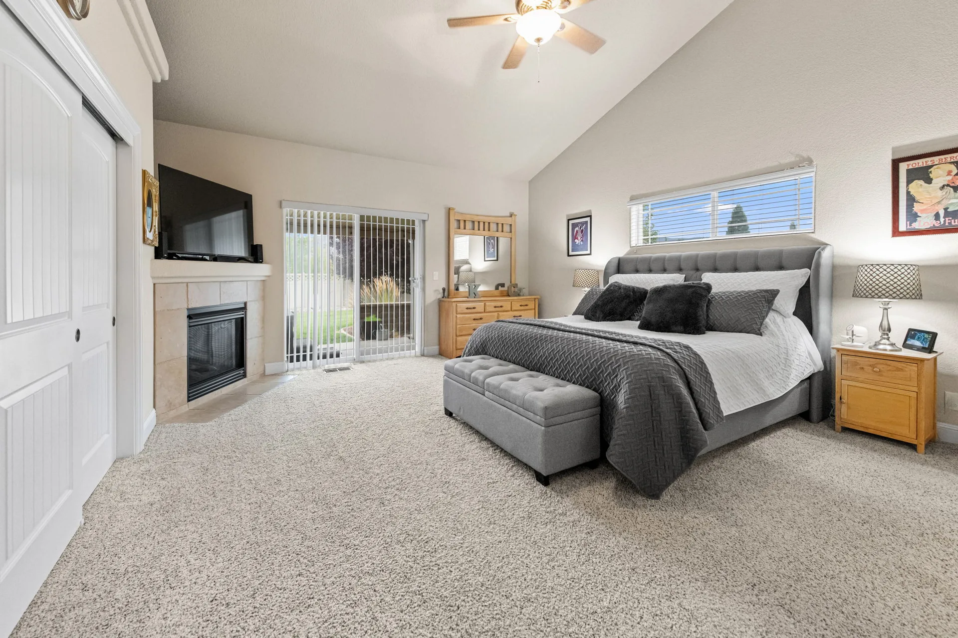Primary bedroom wide-angle with king bed and sitting area