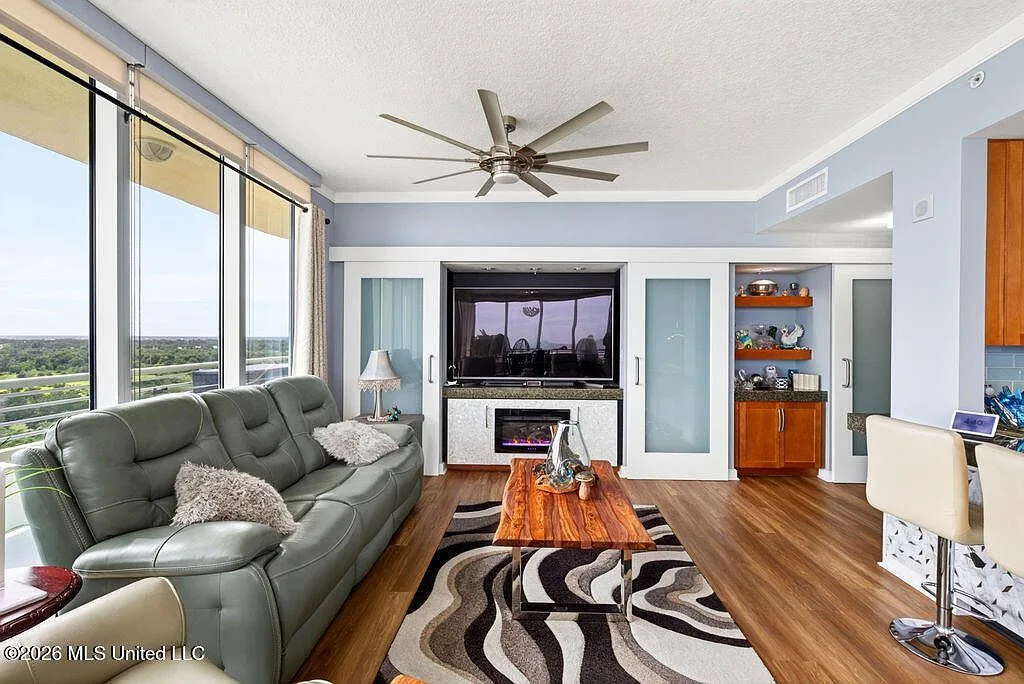 Living room with custom media cabinet and ocean views