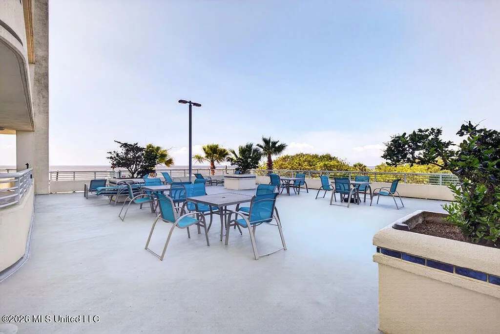 Terrace with dining sets and ocean views