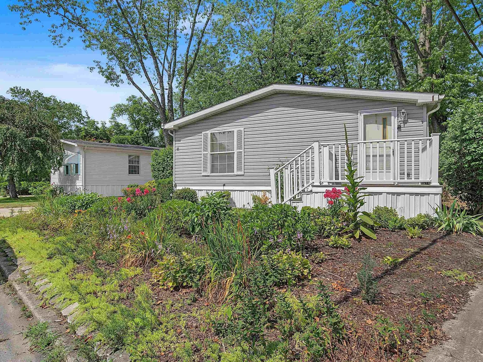 Front deck with railing and stairs