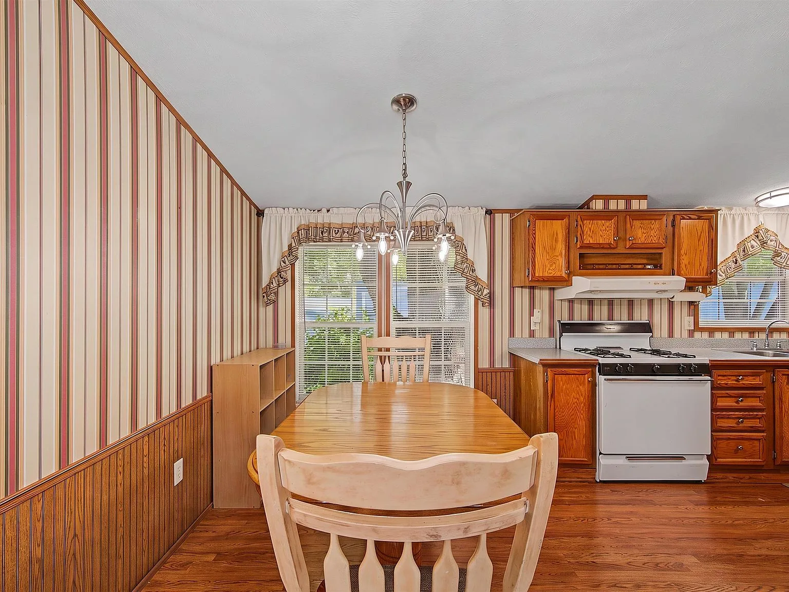 Combined kitchen and dining area with natural daylight
