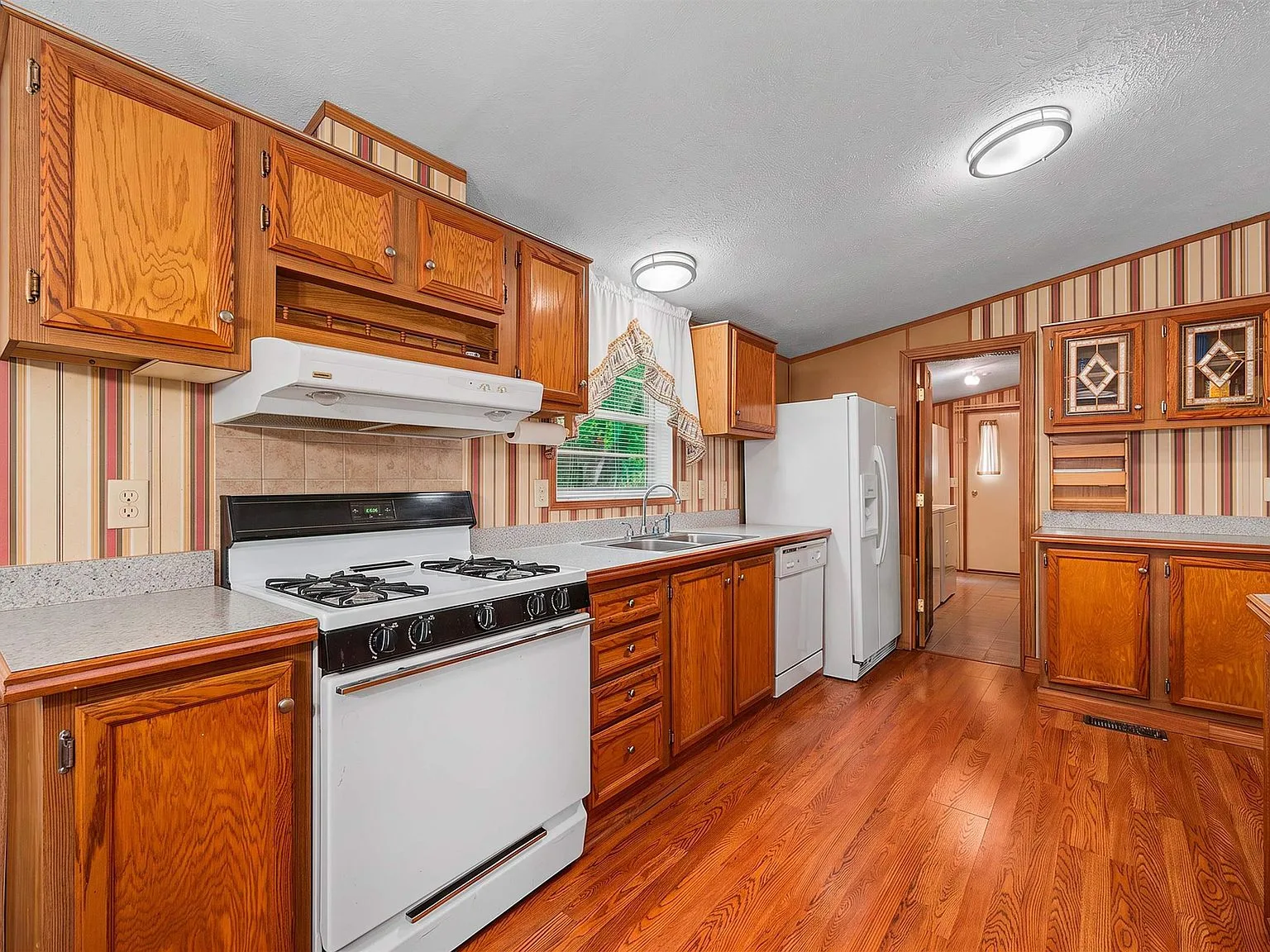 Eat-in kitchen with oak cabinetry