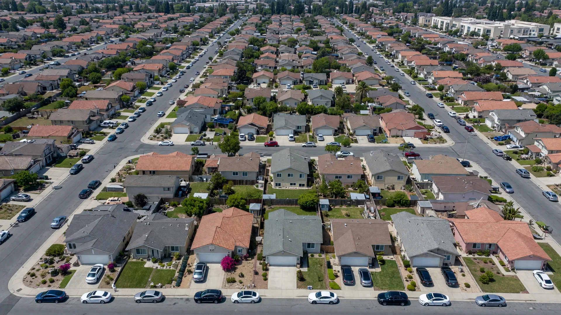 Aerial view of Bay Area suburban neighborhood with closely spaced homes on small lots