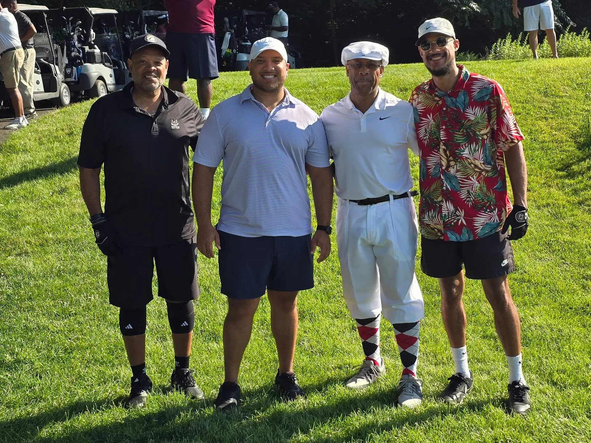 Group of golfers posing together before teeing off at the annual Knickerbocker Golf Club tournament in New Haven