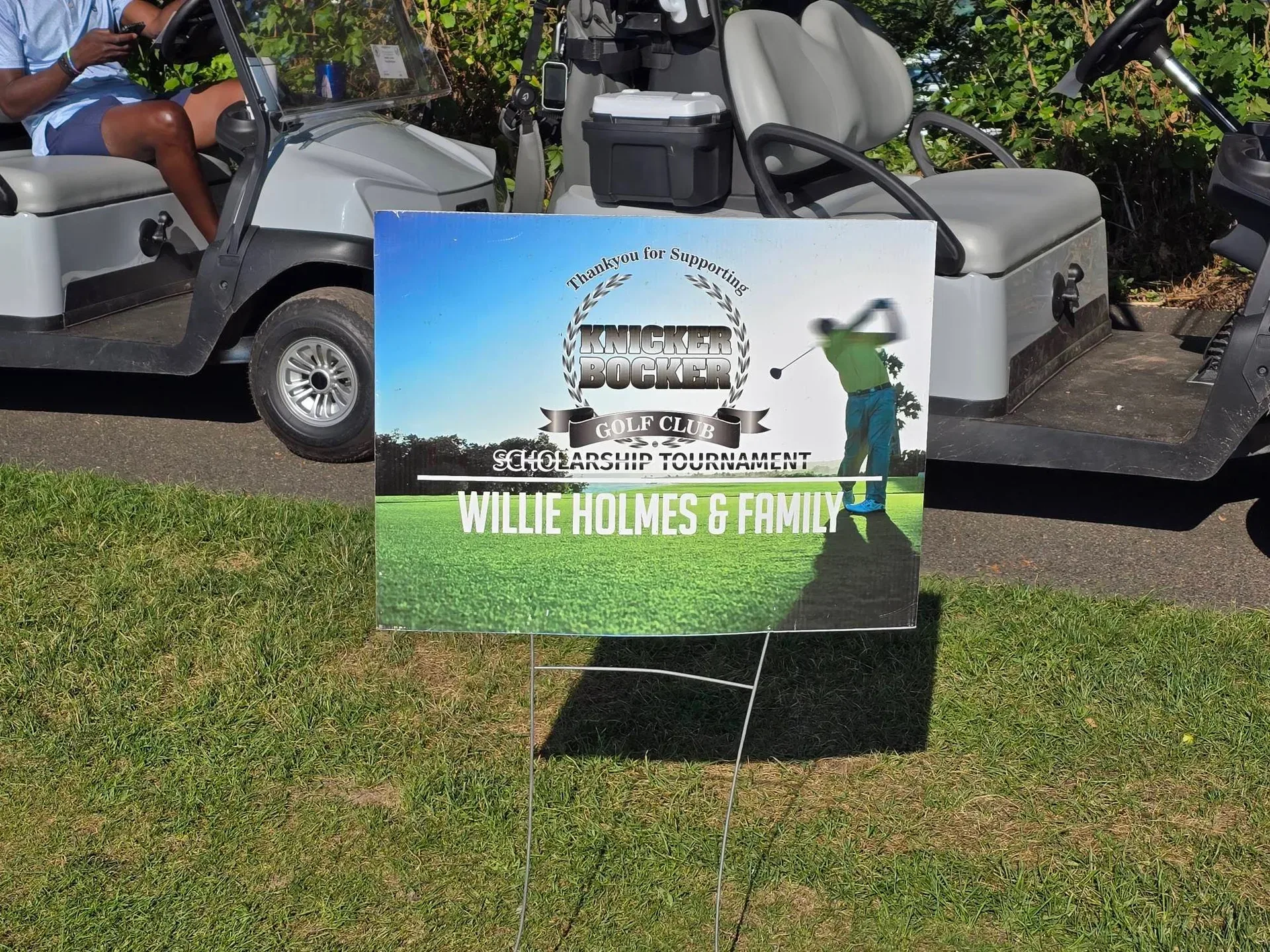 Sponsor signs lining the golf course supporting the Knickerbocker Golf Club Scholarship Fund