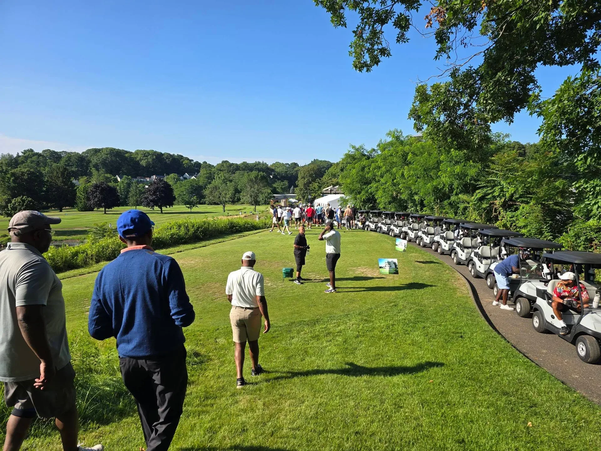 Participants gathering at the Alling Memorial Golf Club clubhouse before the shotgun start of the Knickerbocker tournament