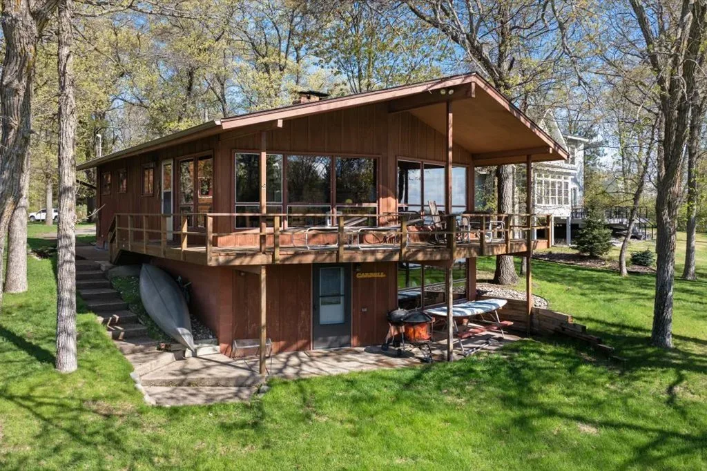 Rear exterior showing elevated wooden deck and wood siding