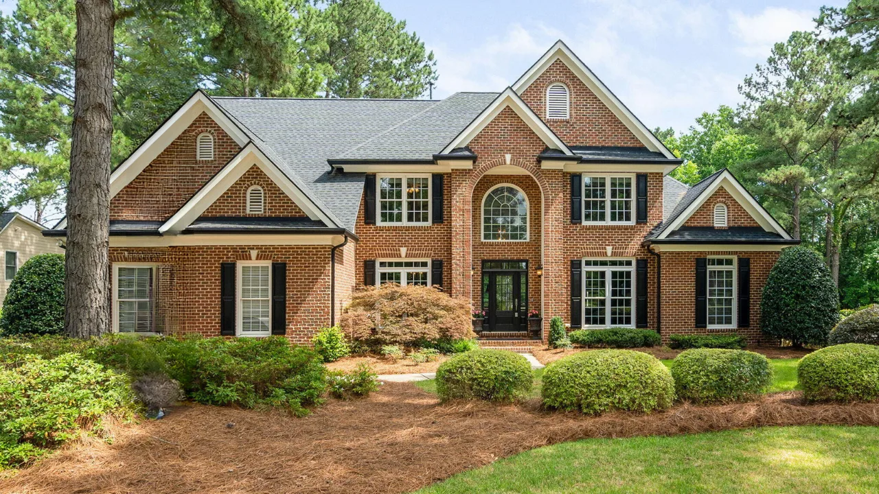 Traditional brick home with black shutters in Preston, Cary NC