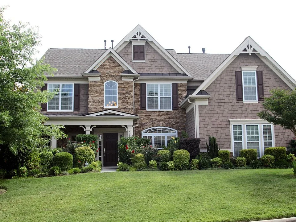 Traditional craftsman-style home with stone veneer accents in Cary Park, Cary NC