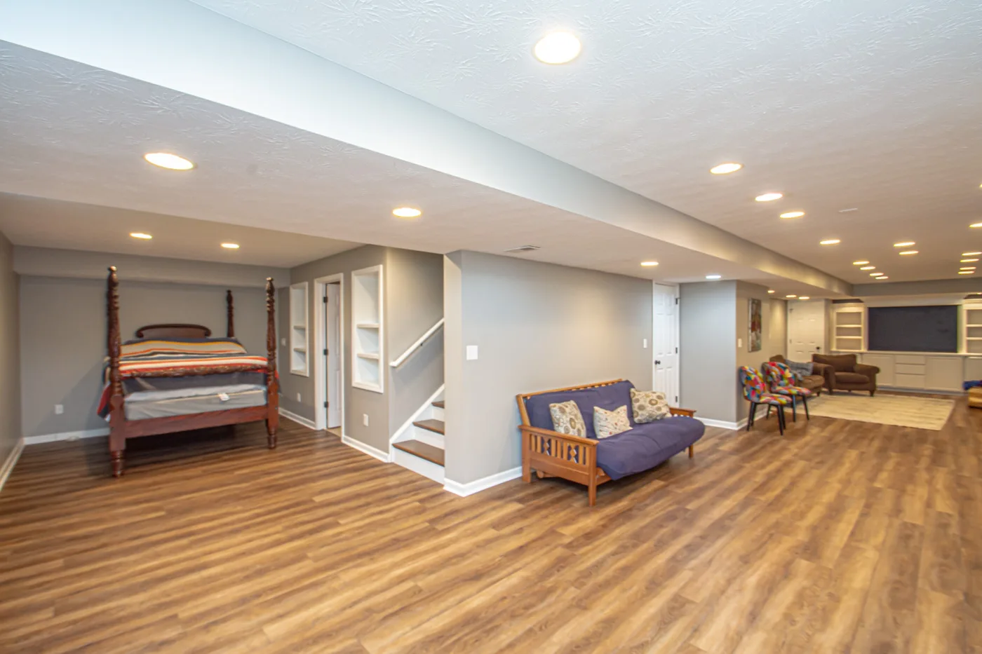 Finished basement recreation room with recessed lighting