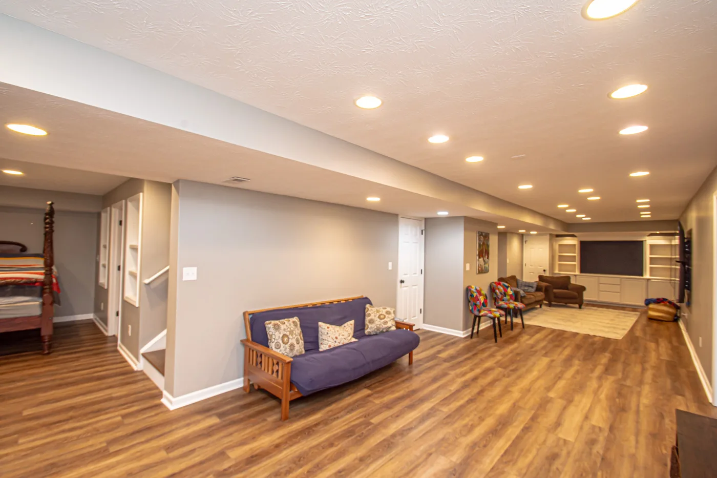 Finished basement with wood-look flooring