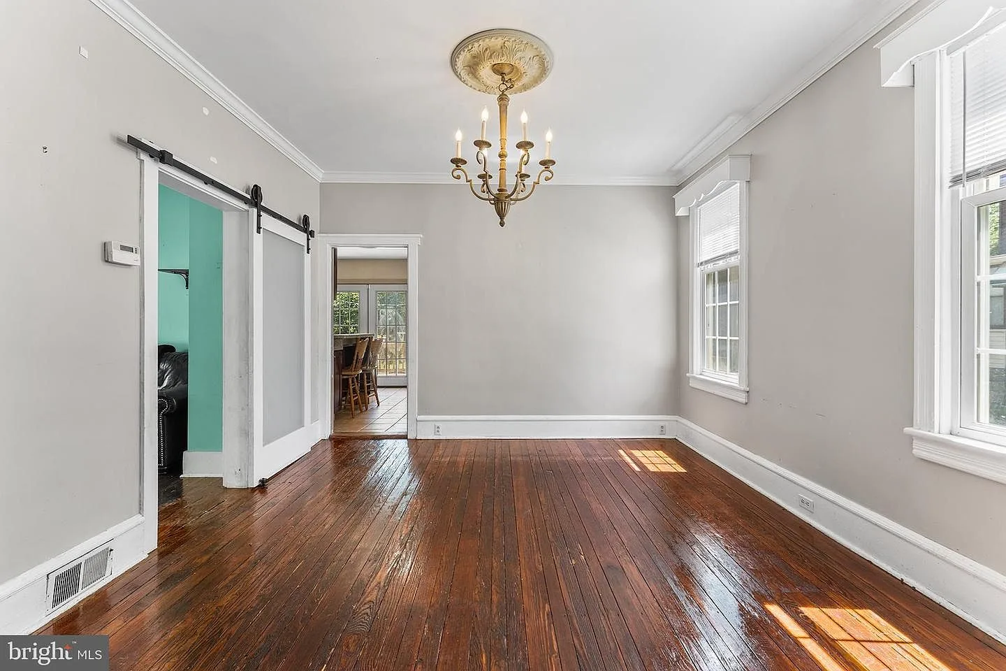 Dining room with polished hardwood floors and ceiling medallion