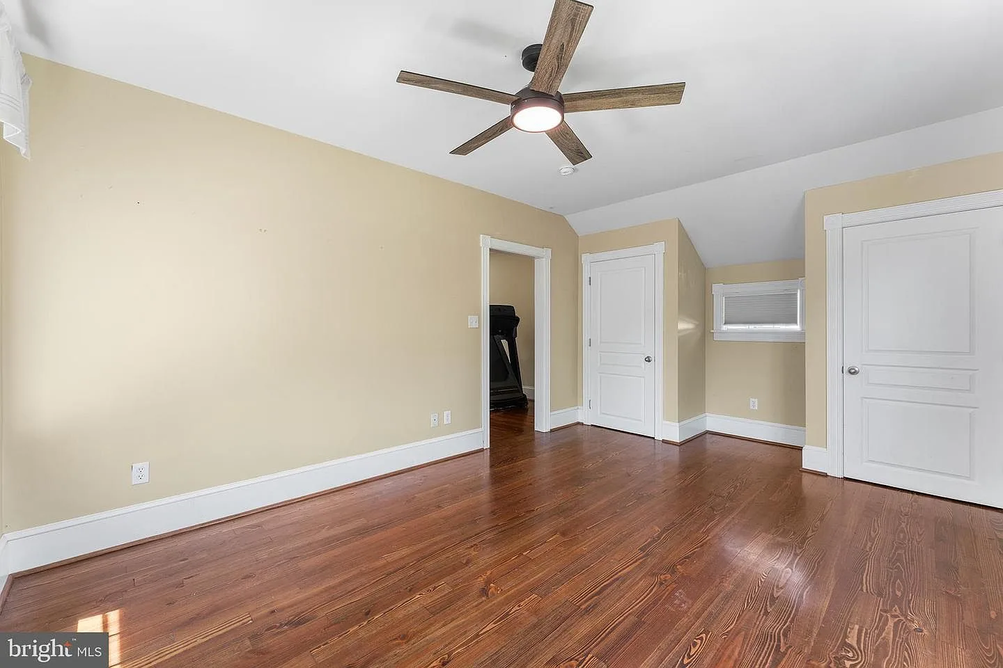 Third-floor suite with vaulted ceilings and hardwood floors