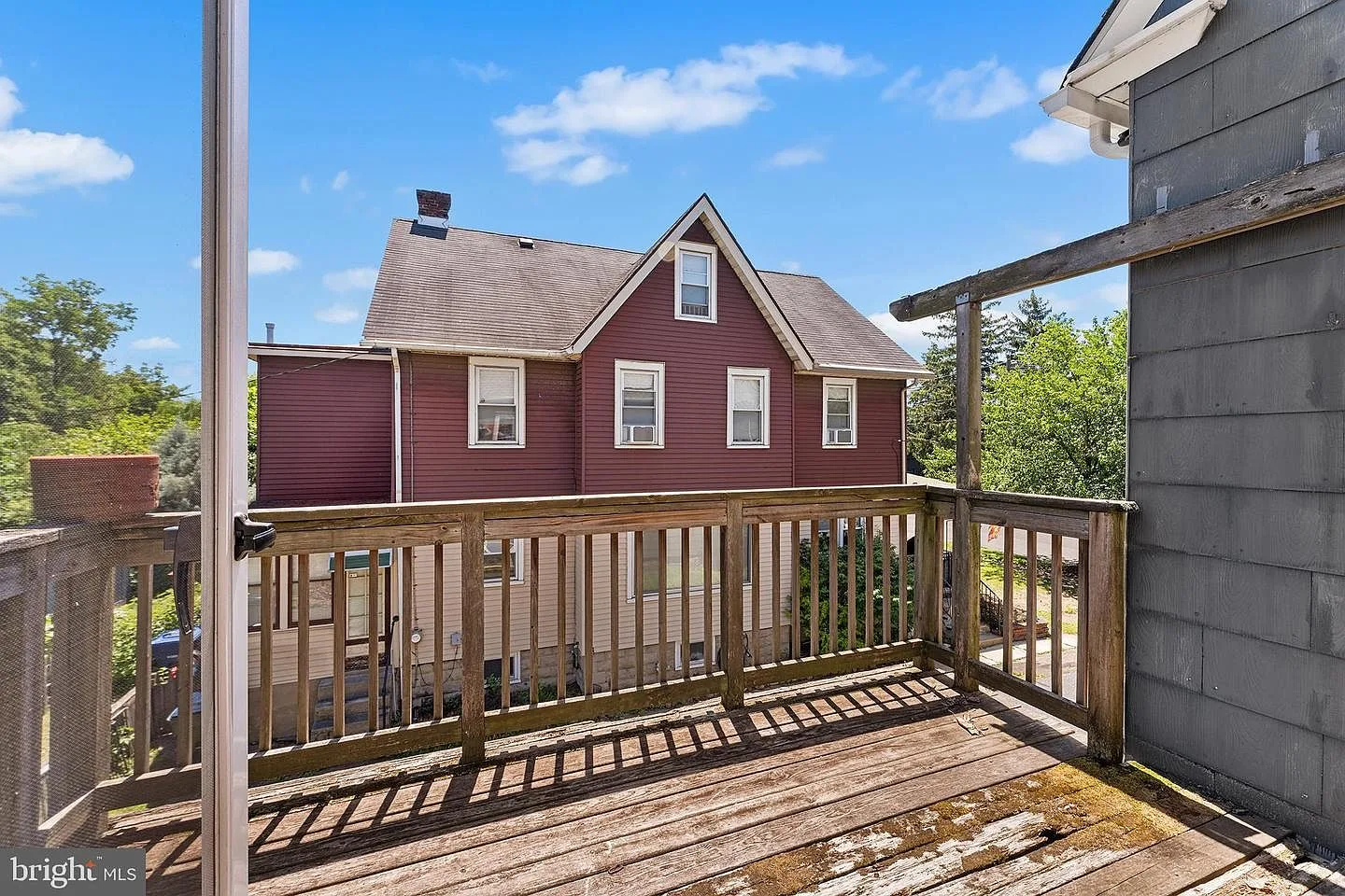 Elevated deck overlooking the rear of the Victorian home