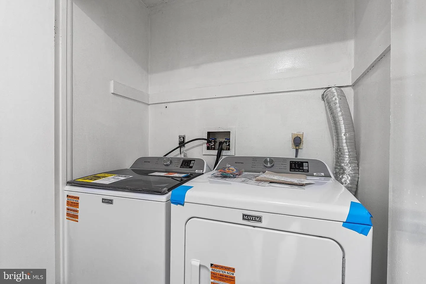Laundry closet with Maytag washer and dryer set