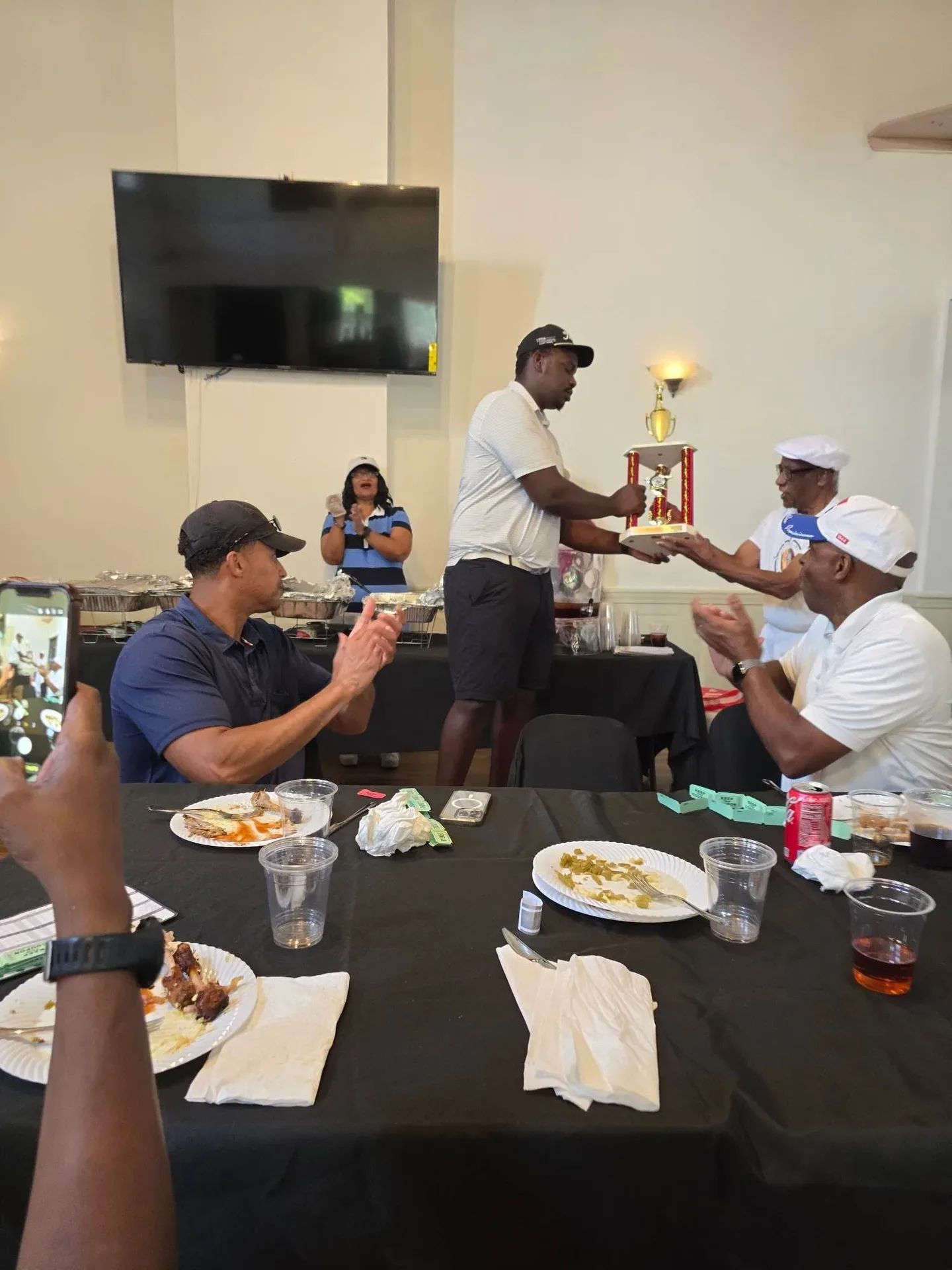 Shamar Wilson celebrates with fellow golfers after his championship victory at the 82nd Annual Knickerbocker Golf Club Scholarship Tournament