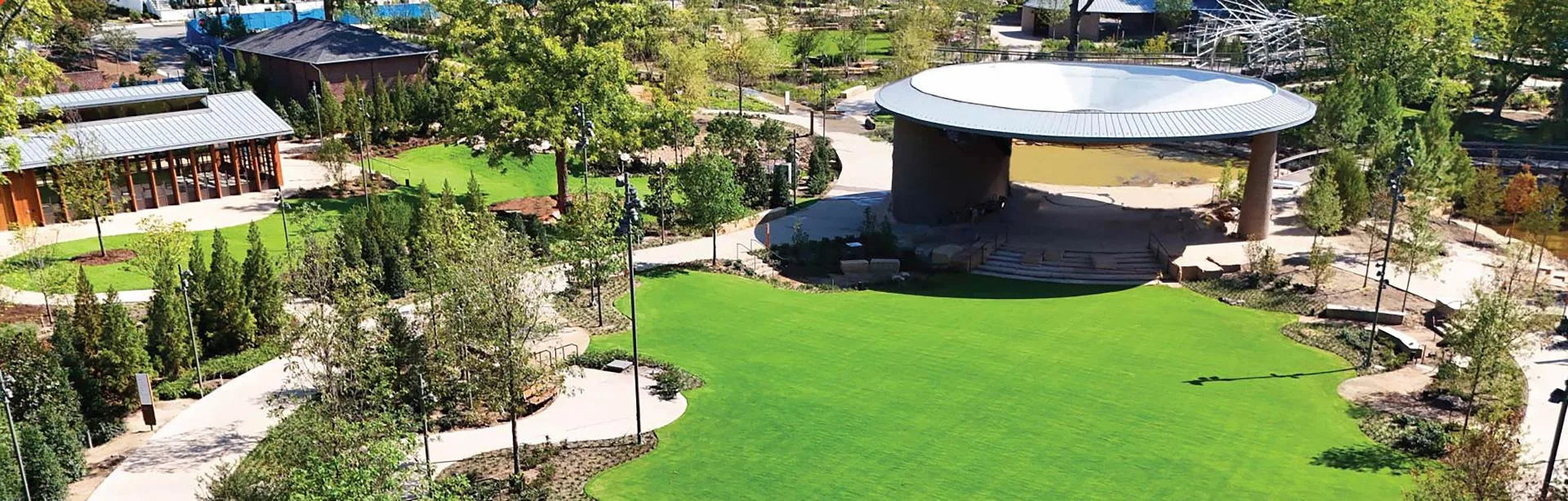Aerial drone shot of Downtown Cary Park with circular pavilion, pedestrian pathways, and manicured lawns