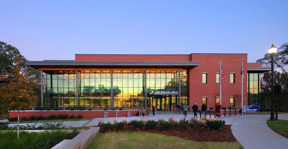 Cary Regional Library modern facade with red brick and glass curtain wall in Downtown Cary, NC