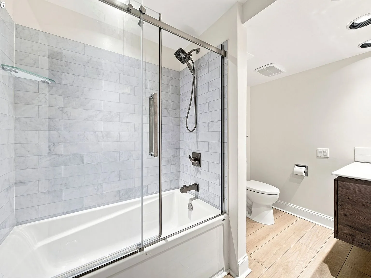 Modern bathroom with marble-look subway tile tub/shower