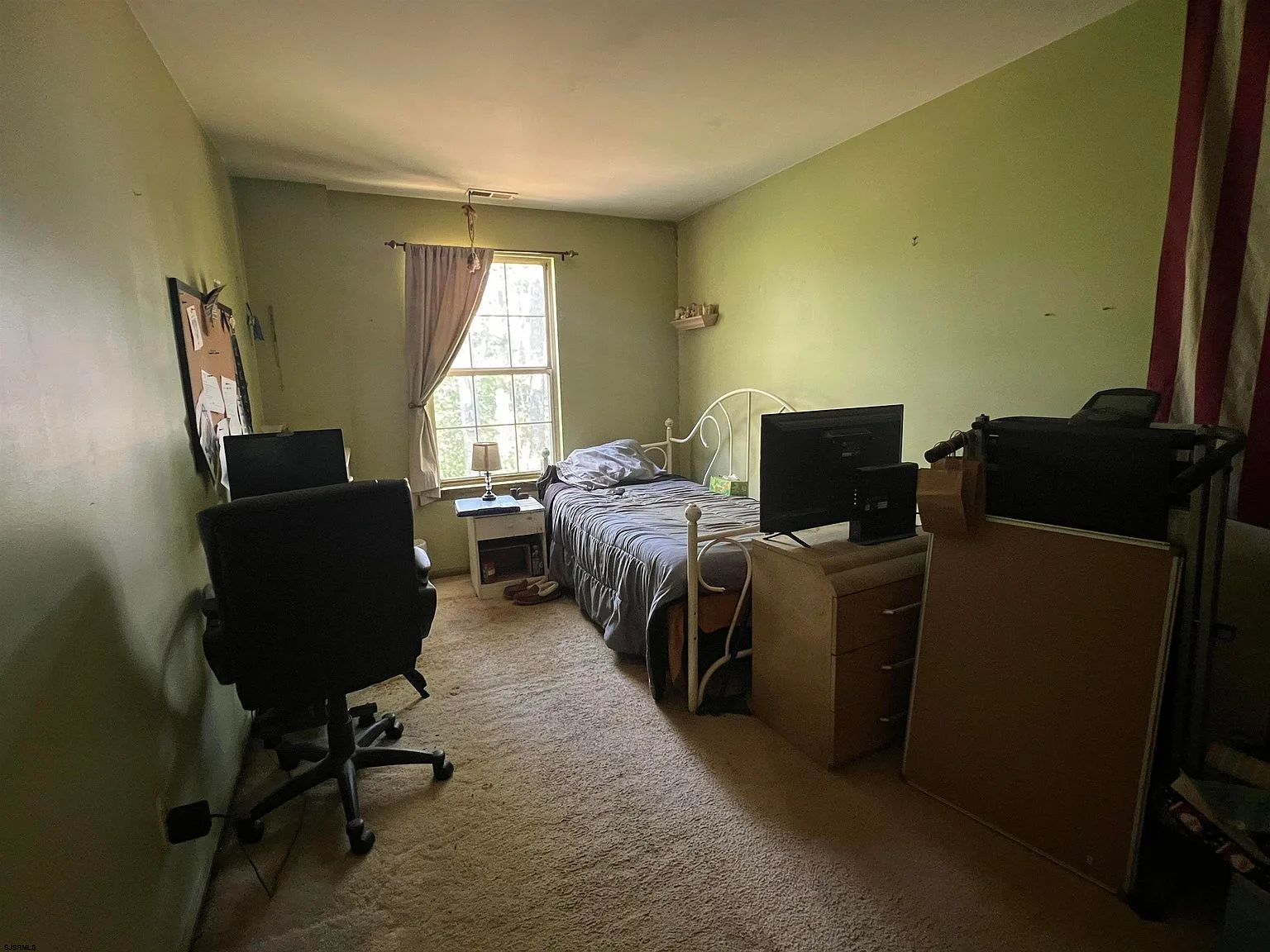 Secondary bedroom with natural window light