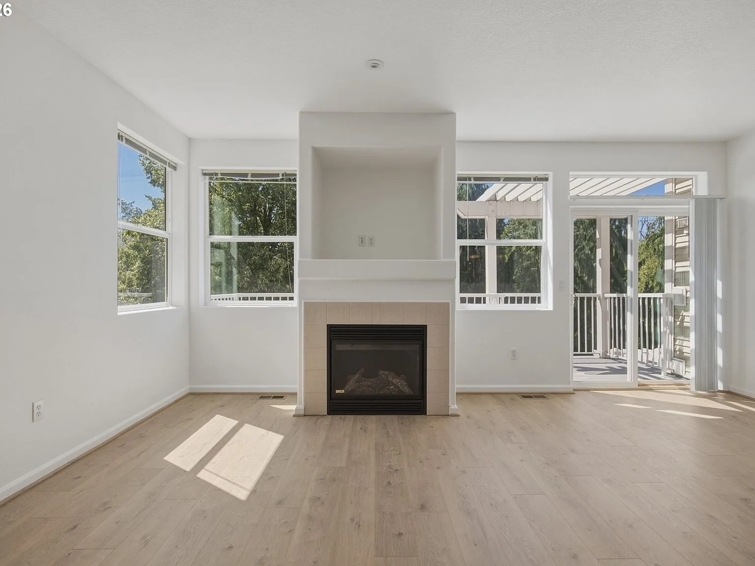 Living room fireplace with tile surround and built-in alcove