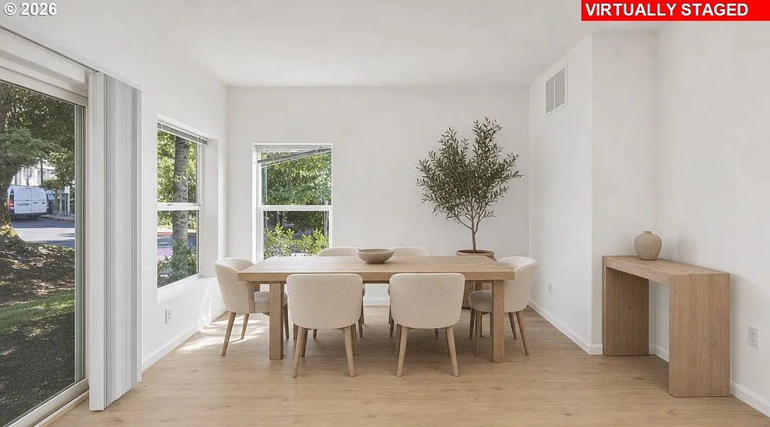 Bright dining area with large windows and modern decor