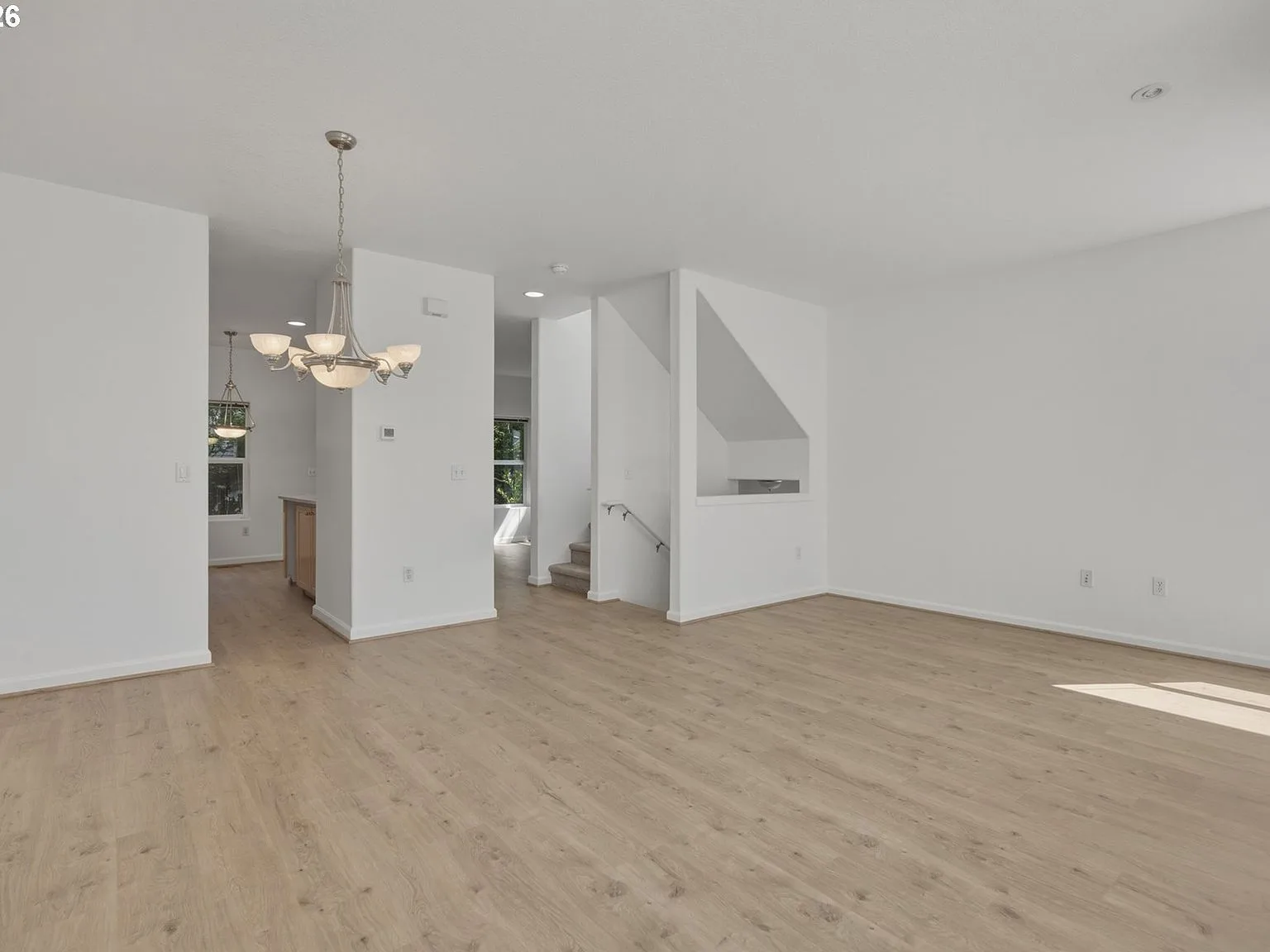 Living room with new laminate flooring and staircase