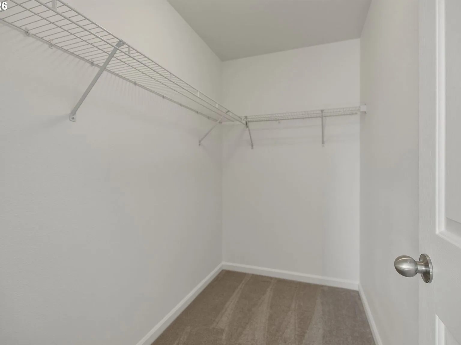 Master walk-in closet with wire shelving