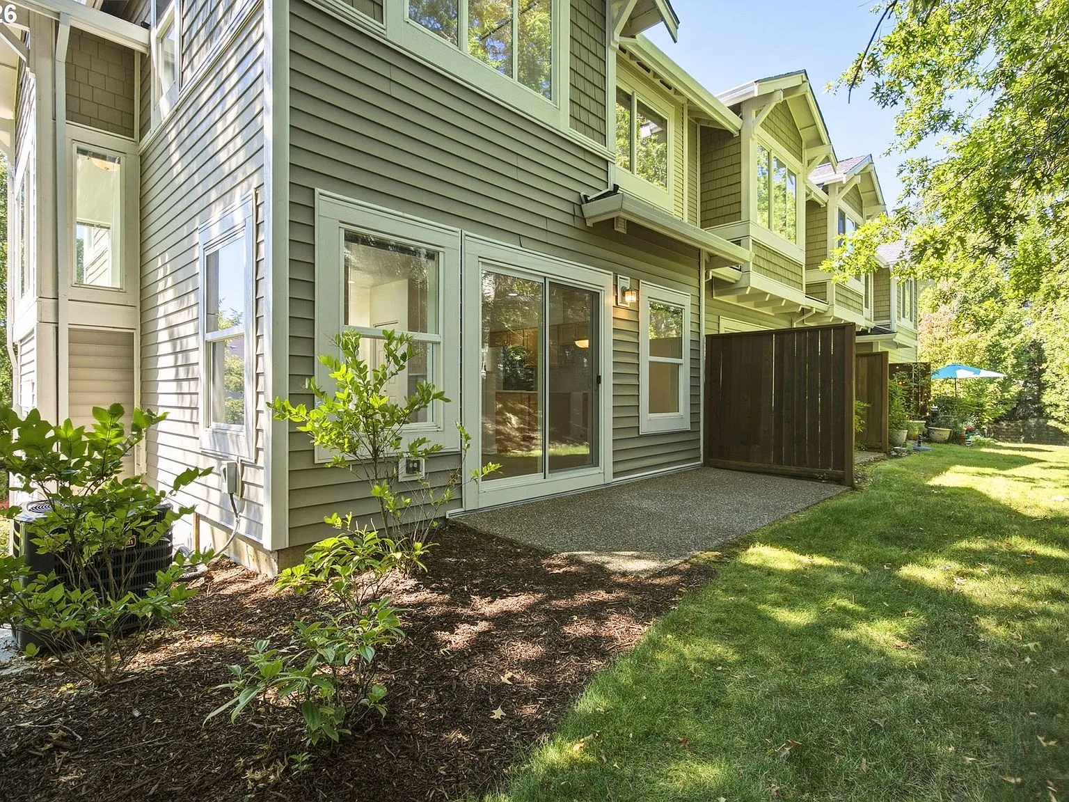 Private back patio with landscaped yard