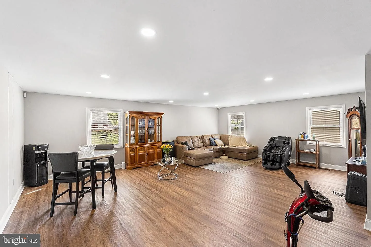 Living and dining room combination with recessed lighting and natural daylight