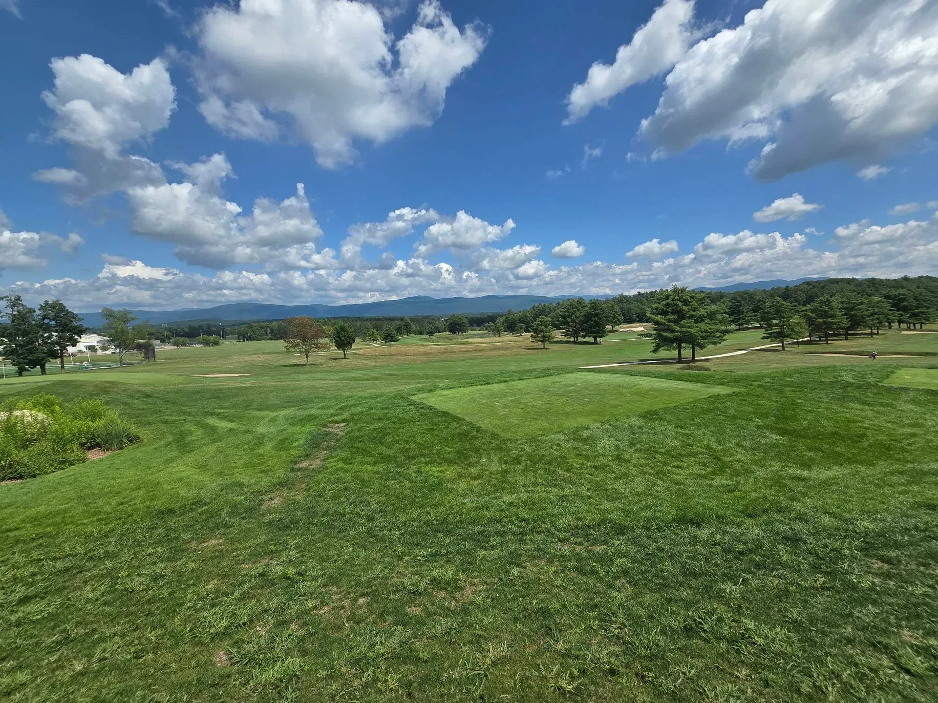 The fairway stretches out toward the Green Mountains at the Ralph Myhre Golf Course