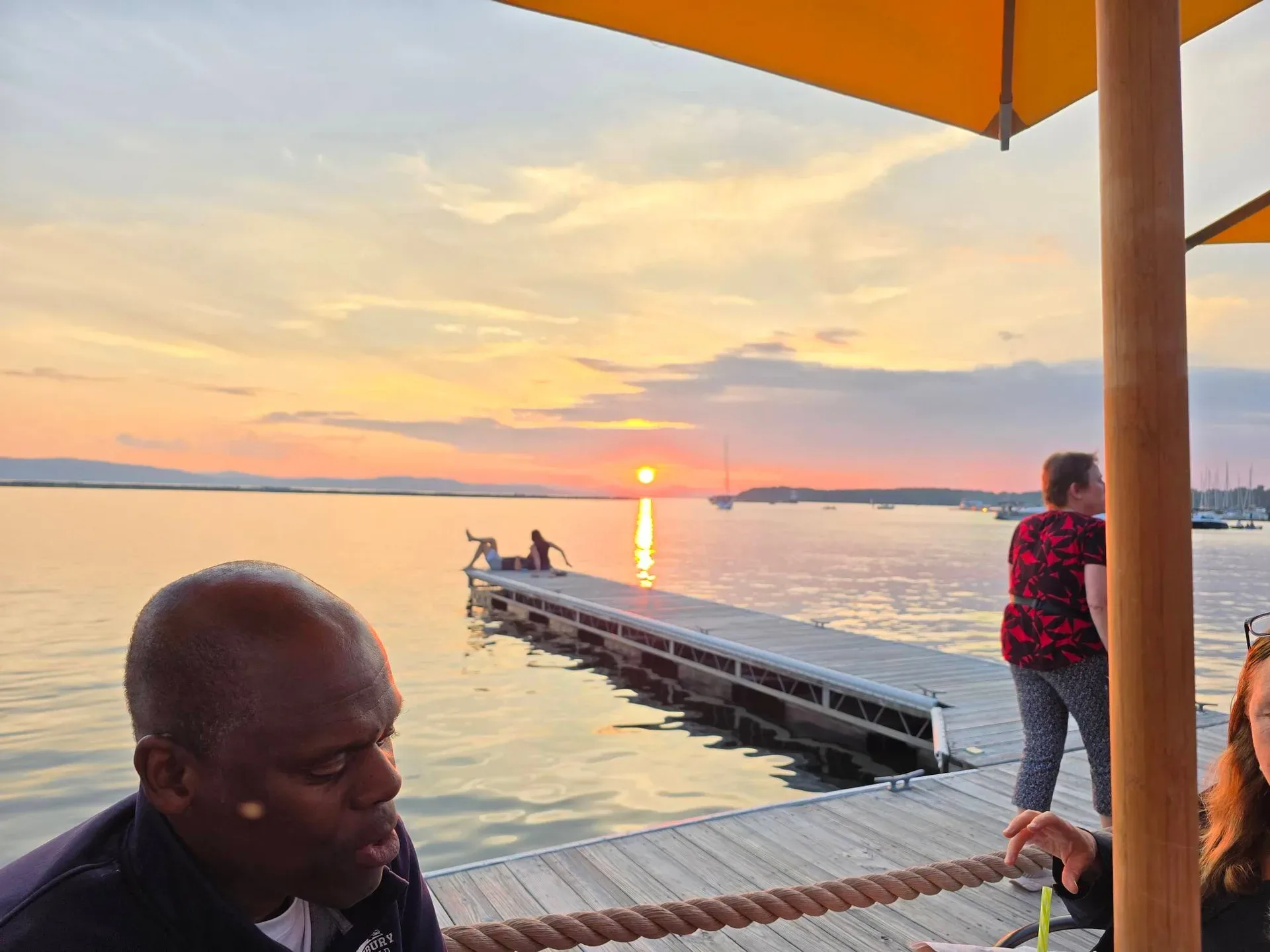 Enjoying the sunset from a waterfront restaurant on Lake Champlain
