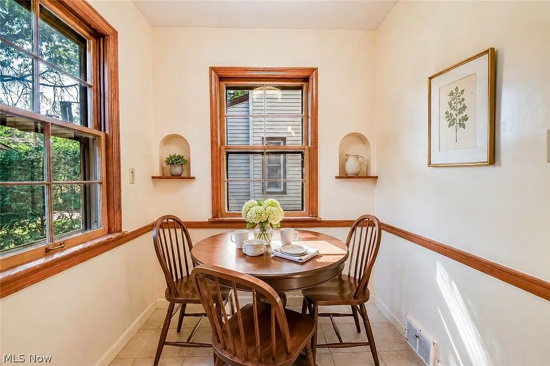 Breakfast nook with arched wall niches and bright natural light