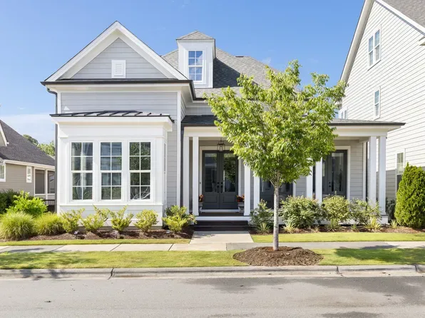 Suburban single-family home in Durham with brick facade and landscaped yard