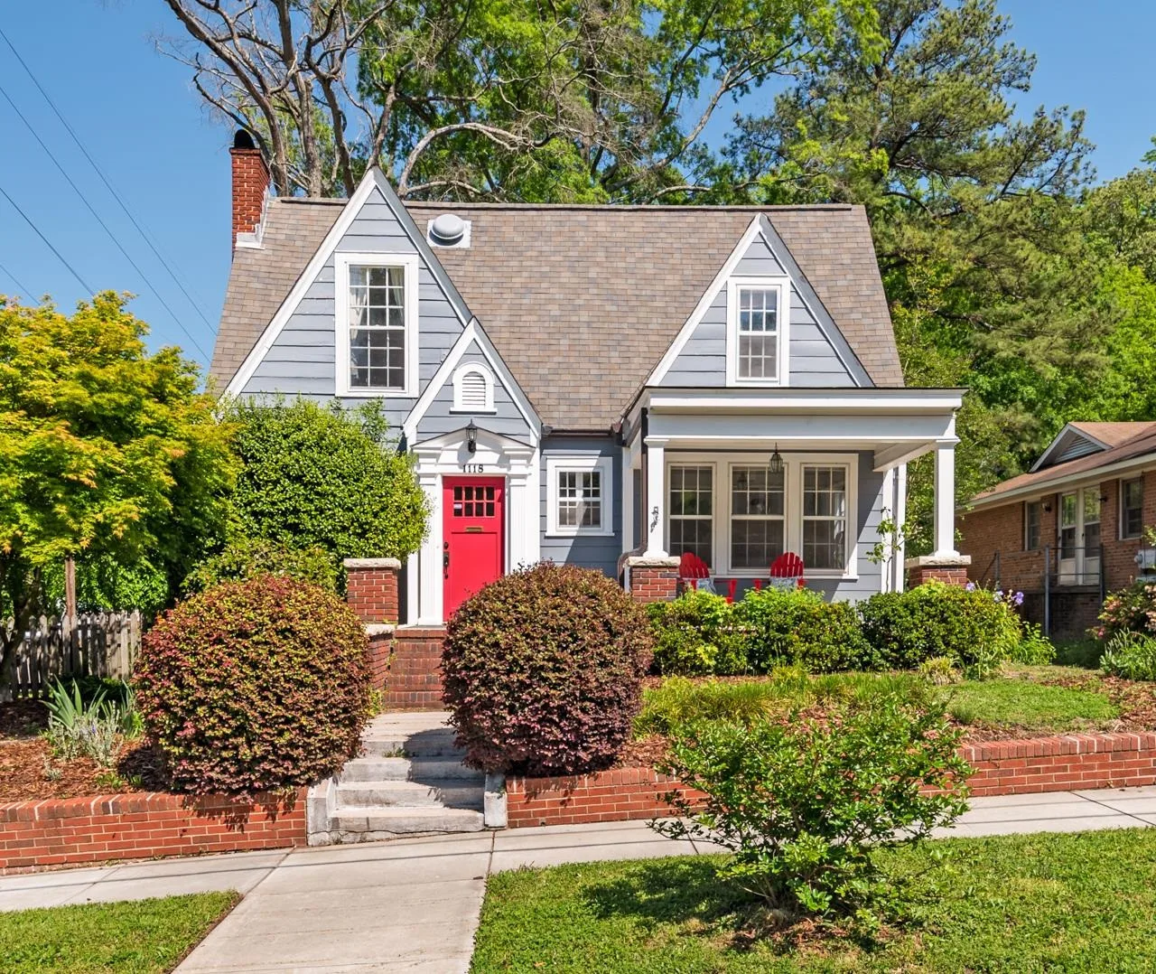 Charming cottage facade with red door in Trinity Park neighborhood