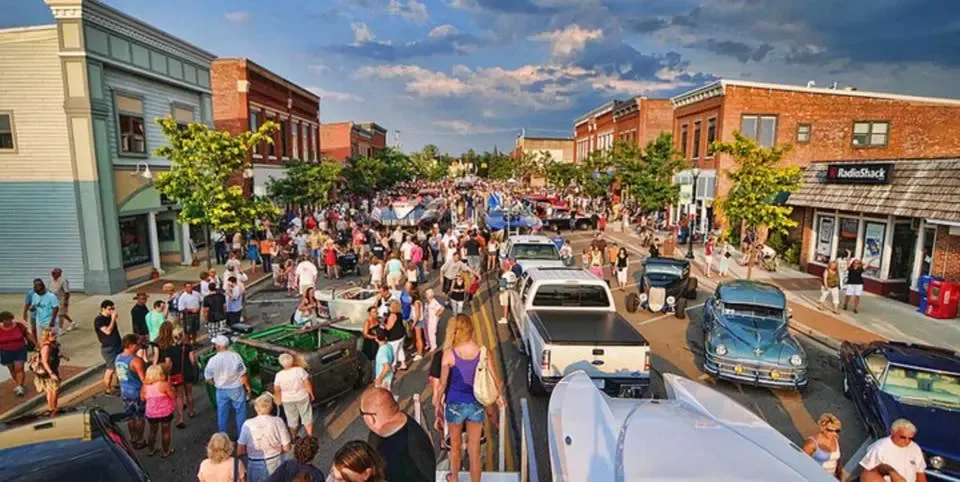 Downtown Clayton street festival with crowds and local vendors