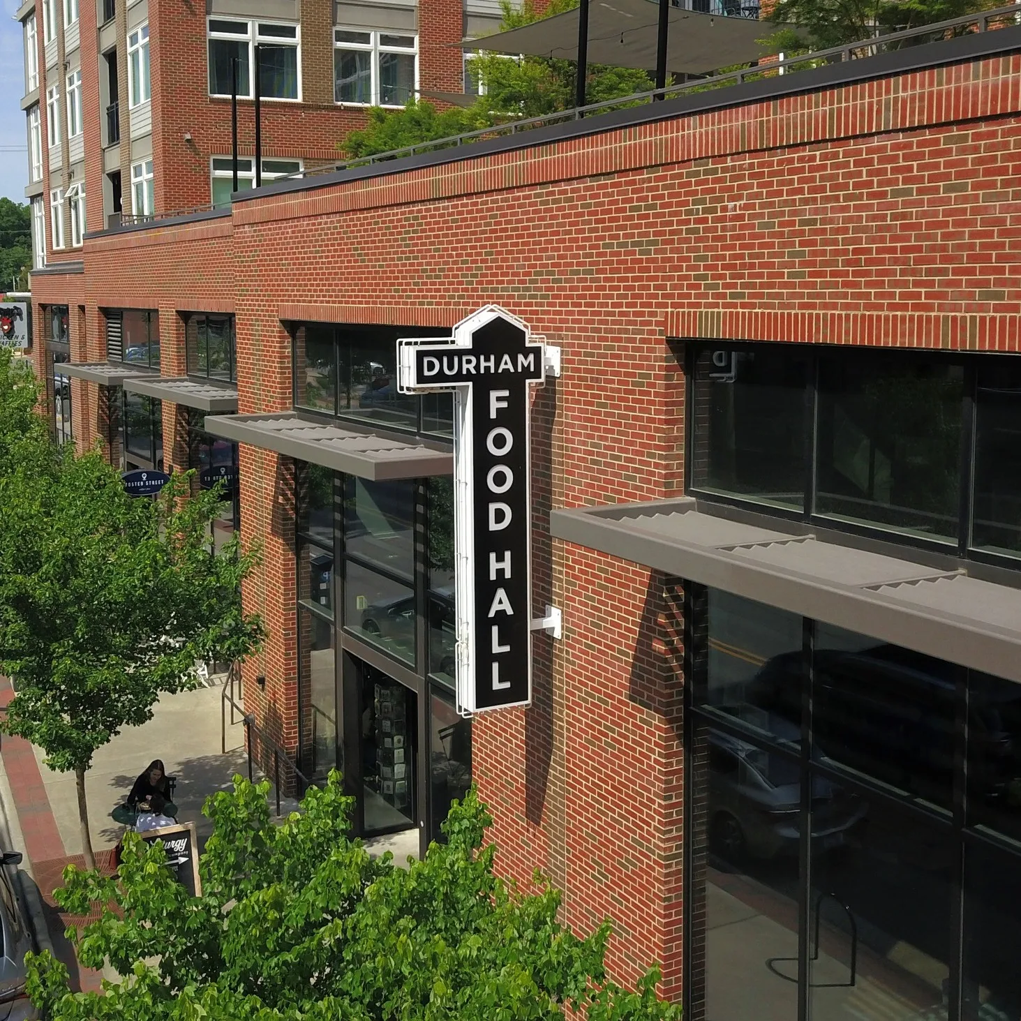 Brick commercial facade of a food hall in downtown Durham