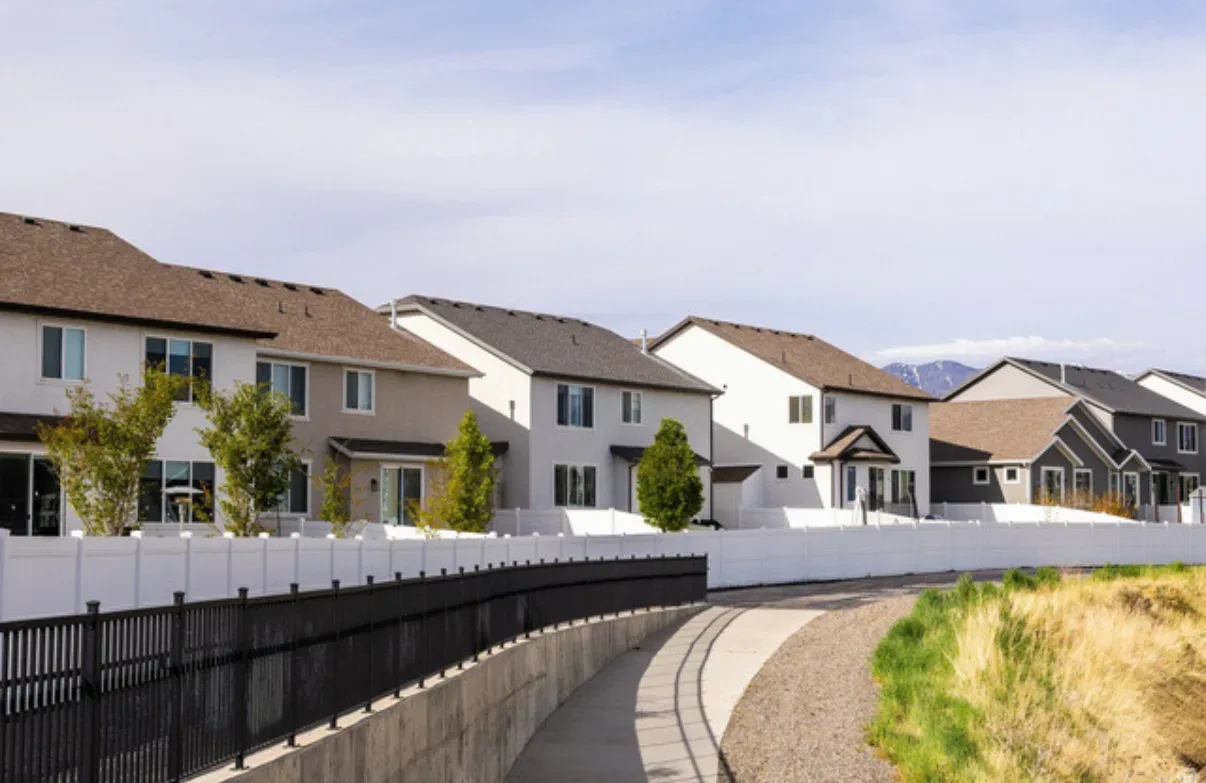 View from walking path showing rear facades of homes in the neighborhood