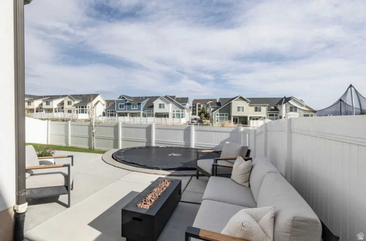 Backyard patio with fire pit and mountain views